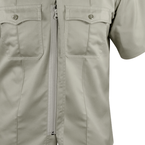 Close-up of the Condor Women's Class B Uniform Shirt in light khaki, featuring short sleeves, two chest pockets with button flaps, and a visible front zipper.