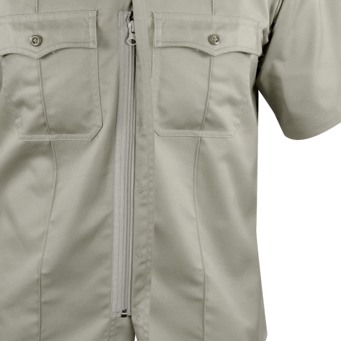 Close-up of the Condor Mens Class B Uniform Shirt in beige, featuring short sleeves, two chest pockets, and a white center zipper. Now on SALE.