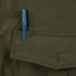 A blue pen is clipped to the top pocket flap of a Condor Guardian Duty Jacket in olive green.