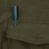 A blue pen is clipped to the outside of an olive green Condor Guardian Duty Jacket pocket with a flap.