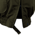 Close-up of the Condor Guardian Duty Jacket | SALE in olive green, featuring a partially unzipped zipper, elastic waistband with stitching, snap button, and hanging strap.