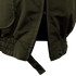 Close-up of the Condor Guardian Duty Jacket in olive green, featuring a partially open zipper at the bottom, elasticized hem, and a buttoned strap detail.