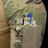 Close-up of a Condor Long Sleeve Combat Shirt Gen II - MultiCam sleeve, showing black and blue pens in a small pocket above a large Velcro patch.