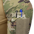 Close-up of a Condor Long Sleeve Combat Shirt Gen II - MultiCam sleeve, showing black and blue pens in a small pocket above a large Velcro patch.