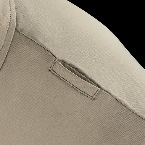 Close-up of a Condor Short Sleeve Dri-Flex Tactical Polo in beige, showing the shoulder with a small horizontal fabric loop stitched near the seam.
