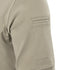 Close-up of a Condor Short Sleeve Dri-Flex Tactical Polo in beige, showing its sleeve with a rectangular patch pocket detailed by two stitched horizontal lines near the top.