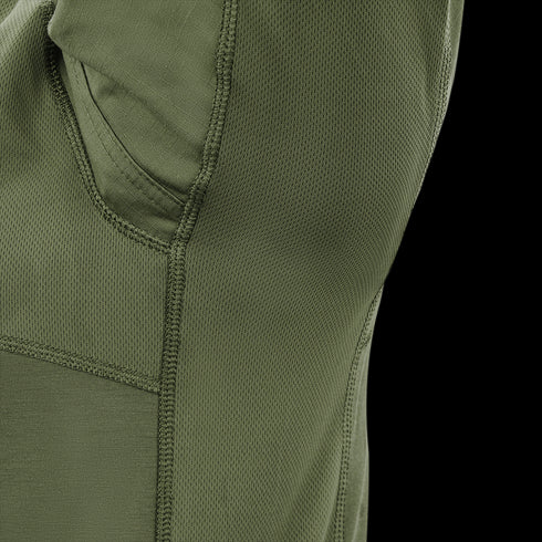 Close-up of Condors Long Sleeve Combat Shirt Gen II in green, showing a seam, small pocket, and a mix of textured and smooth fabric panels.