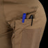 Close-up of the Condor Short Sleeve Combat Shirt Gen II’s brown, lightweight sleeve pocket holding a blue and a black pen, with a velcro patch below the pocket opening.