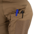 Close-up of the Condor Short Sleeve Combat Shirt Gen II’s brown, lightweight sleeve pocket holding a blue and a black pen, with a velcro patch below the pocket opening.