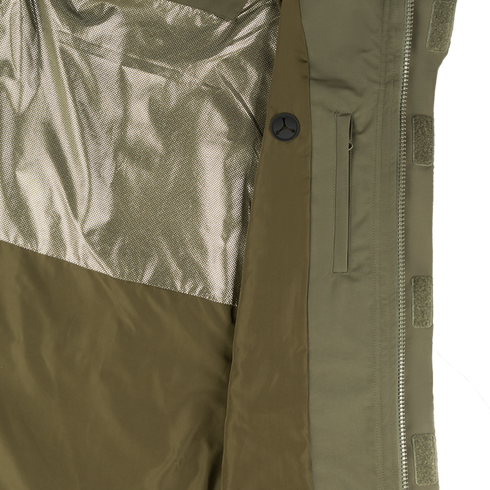 Close-up of the interior of the Condor Aegis Waterproof Parka, featuring a shiny mesh lining, a vertical zippered pocket, and a button detail near the edge.