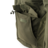 Close-up of the Condor Aegis Waterproof Parka’s olive green pocket featuring a flap closure and drawstring toggle.