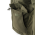 Close-up of the Condor Aegis Waterproof Parka’s olive green pocket featuring a flap closure and drawstring toggle.