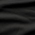 Close-up of the Condor Trident Sun Shirt’s black textured fabric, featuring subtle horizontal folds and a fine, slightly raised pattern.