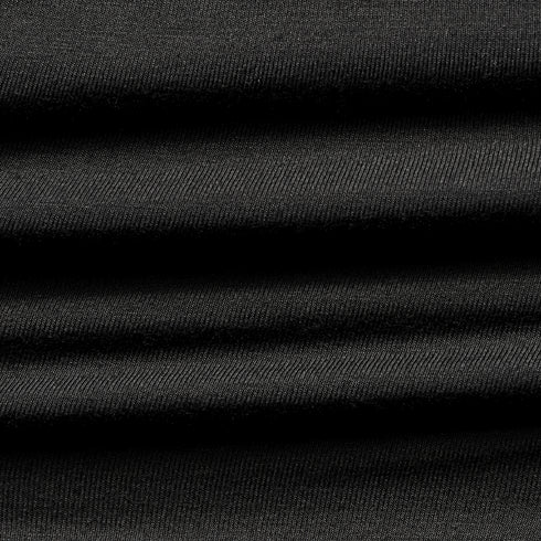 Close-up of the Condor Trident Sun Shirt reveals its layered, ribbed black fabric with horizontal folds and fine texture.