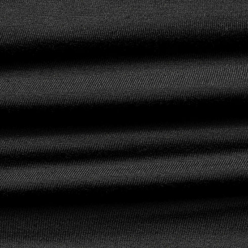 Close-up of the Condor Trident Sun Shirt reveals its layered, ribbed black fabric with horizontal folds and fine texture.