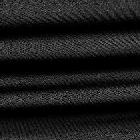 Close-up of the Condor Trident Sun Shirt reveals its layered, ribbed black fabric with horizontal folds and fine texture.