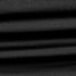 Close-up of the Condor Trident Sun Shirt reveals its layered, ribbed black fabric with horizontal folds and fine texture.