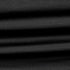 Close-up of the Condor Trident Sun Shirt reveals its layered, ribbed black fabric with horizontal folds and fine texture.