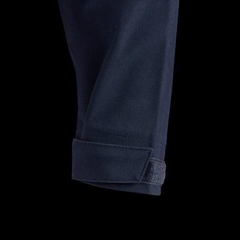 Close-up of the Condor Patrol Quarter Zip Softshell Gen II in navy blue, showing a hook-and-loop fastener strap near the cuff—perfect for bushcraft or military use—on a white background.