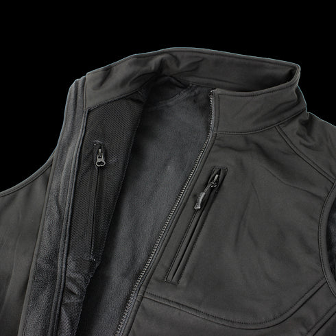 A close-up of the Condor Core Softshell Vest in black, ideal for EDC, shows its zippered chest pocket and partially opened main zipper.
