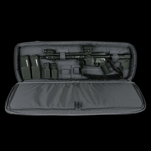 The Condor 36 Javelin Rifle Case displays a black rifle, magazines, and accessories arranged inside its padded interior—perfect for secure transport, making it ideal for military or law enforcement use.