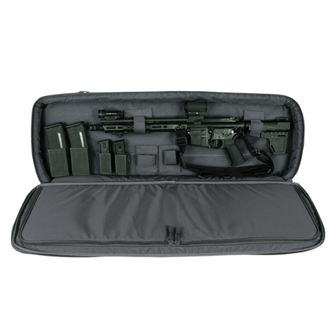 A Condor 36" Javelin Rifle Case in gray displays a black rifle with accessories, magazines, and attachments organized inside its padded, open interior.