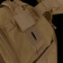 Close-up of the Condor Orion Assault Backpack 50L in brown, built for EDC with a velcro patch and hydration tube opening.