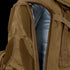 Close-up of the Condor Orion Assault Backpack 50L in brown, showing a partially opened zipper that reveals the blue interior lining.