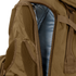 Close-up of the Condor Orion Assault Backpack 50L in brown, showing a partially opened zipper that reveals the blue interior lining.