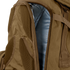 Close-up of the Condor Orion Assault Backpack 50L in brown, showing a partially opened zipper that reveals the blue interior lining.