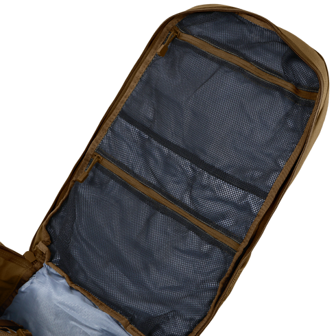 The Condor Orion Assault Backpack 50L is shown open on a flat surface, revealing several zippered mesh compartments inside the lid.
