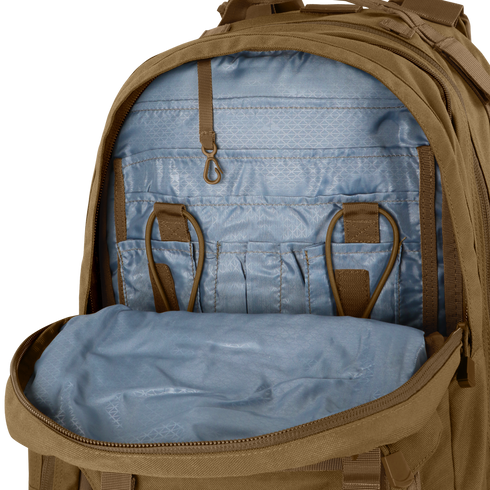 The Condor Orion Assault Backpack 50L in brown showcases organized interior pockets, loops, and compartments for EDC or range gear, displayed against a neutral background.