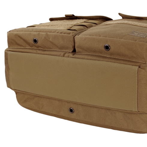 Close-up view of the bottom and side of the Condor Elite Metropolis Briefcase by Condor, featuring brown tactical fabric, grommet holes, and reinforced stitching.