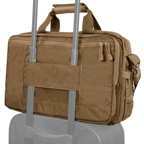 The Condor Elite Metropolis Briefcase in tan, featuring two zippers and a rear strap, is secured to the handle of a rolling suitcase.