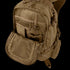 The Condor Elite Titan Assault Backpack 40L by Condor, shown in tan with multiple compartments and zippers, has its front pocket unzipped to reveal mesh and fabric organizers—ideal for bushcraft or first responders.