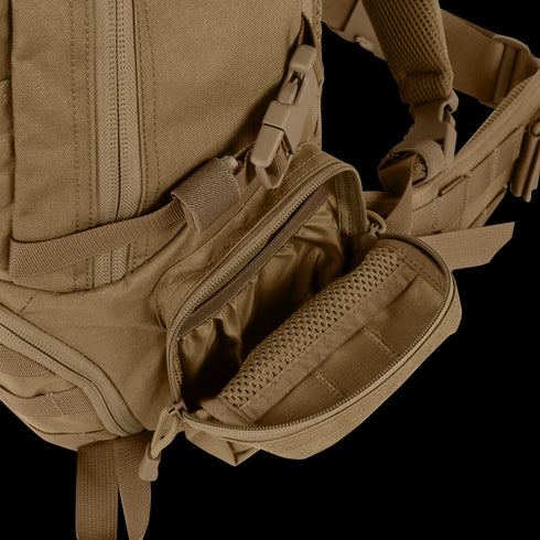 Close-up of the Condor Elite Titan Assault Backpack 40L by Condor, tan color, with open front pocket revealing interior compartments and zippers—perfect for EDC or bushcraft gear.