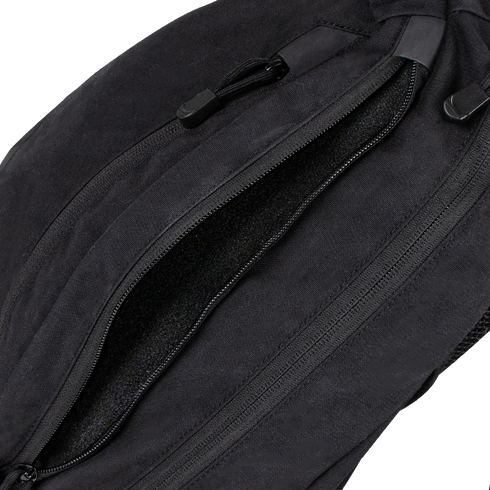 Close-up of a partially unzipped Condor Elite Sector Sling Bag 18L by Condor, highlighting the zipper and pull tabs.