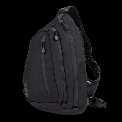 The Condor Elite Sector Sling Bag 18L by Condor features two zippered compartments, a small side pocket, and an adjustable padded shoulder strap in tactical black.