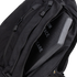 A Condor Elite Sector Sling Bag 18L in black is shown with a partially open zipper, revealing a protective ballistic plate inside.