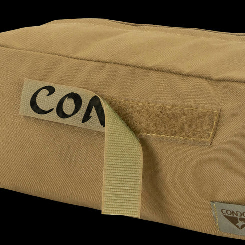 Close-up of a MultiCam Black Kit Bag by Condor, featuring durable fabric, a Velcro strip, partial handwritten label CON, and Condor tag—perfect for military or first responder use.