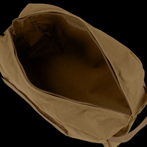 The Condor Kit Bag, made of brown canvas with a zipper, is shown open and empty to reveal its spacious inner compartment—perfect for bushcraft adventures or trips to the shooting range.