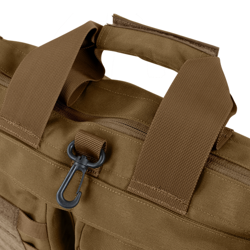 Close-up of the Condor Aviator Bag 15L in brown tactical fabric with reinforced handles, a zipper, and a black plastic clip on a loop—perfect for military or first responder use.