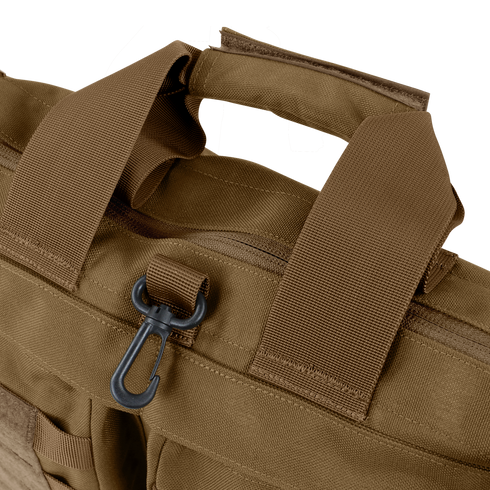 Close-up of the Condor Aviator Bag 15L in brown tactical fabric with reinforced handles, a zipper, and a black plastic clip on a loop—perfect for military or first responder use.