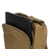 A tan Condor Prime Pack 21L tactical backpack with a partially open zipper shows a black laptop inside the main compartment.
