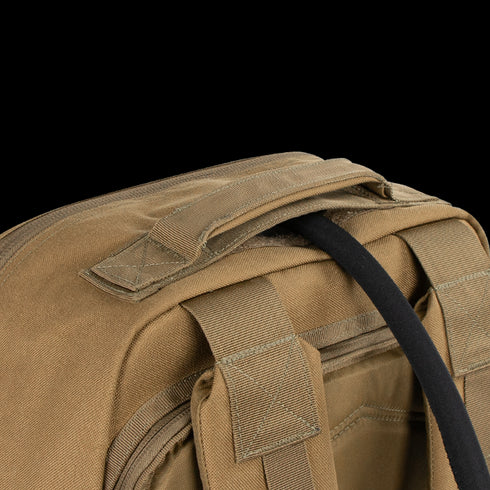 Close-up of the Condor Prime Pack 21L in tan fabric, featuring a sturdy handle, reinforced stitching, and a black strap—engineered for durability to meet military or first responder demands.