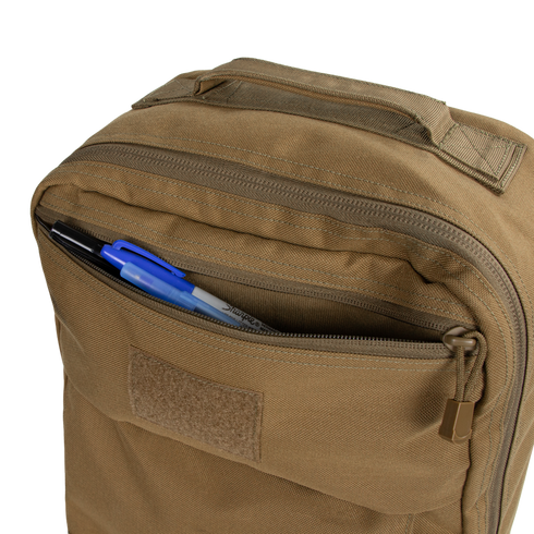 The Condor Prime Pack 21L is a tan tactical backpack with a partially open front zippered pocket, revealing black and blue pens and a marker—perfect for first responders on the move.