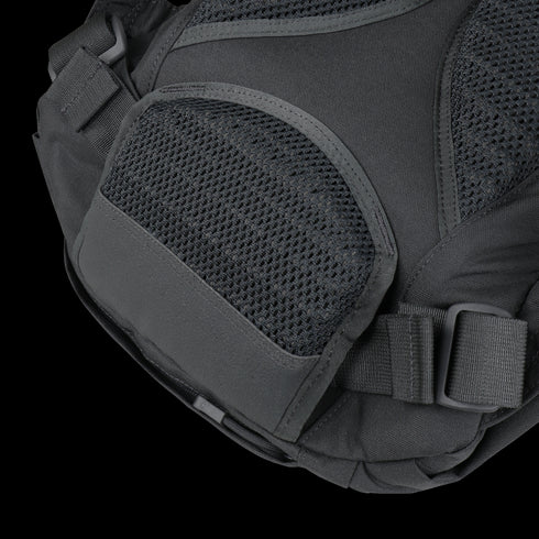 Close-up of the Condor Elite Fail Safe Urban Backpack Gen II 18L’s black pocket with mesh detailing and a plastic buckle strap by Condor, perfect for EDC or military use.