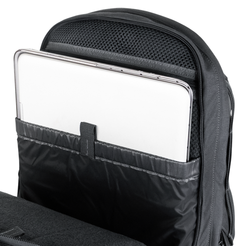 A silver laptop partially inserted into a padded compartment inside a Condor Elite Fail Safe Urban Backpack Gen II 18L by Condor, designed for first responder essentials.