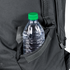 A clear plastic water bottle with a green cap sits in the side pocket of the Condor Elite Fail Safe Urban Backpack Gen II 18L by Condor, ready for a shooting range session or an outdoor bushcraft adventure.