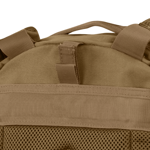 Close-up of the Condor Compact Assault Backpack Gen II 24L in tan, a top pick among military and bushcraft users, highlighting its webbing, mesh fabric, and sturdy top carrying handle.